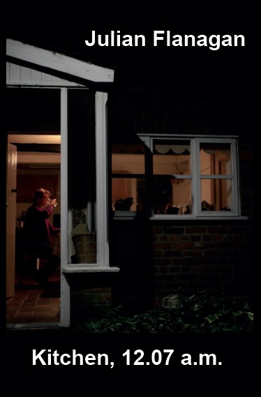 photo of man in kitchen seen through door in darkness